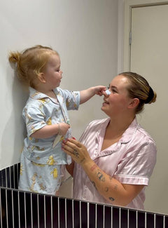 Baby Applying Nasal Strip to the Woman's Nose