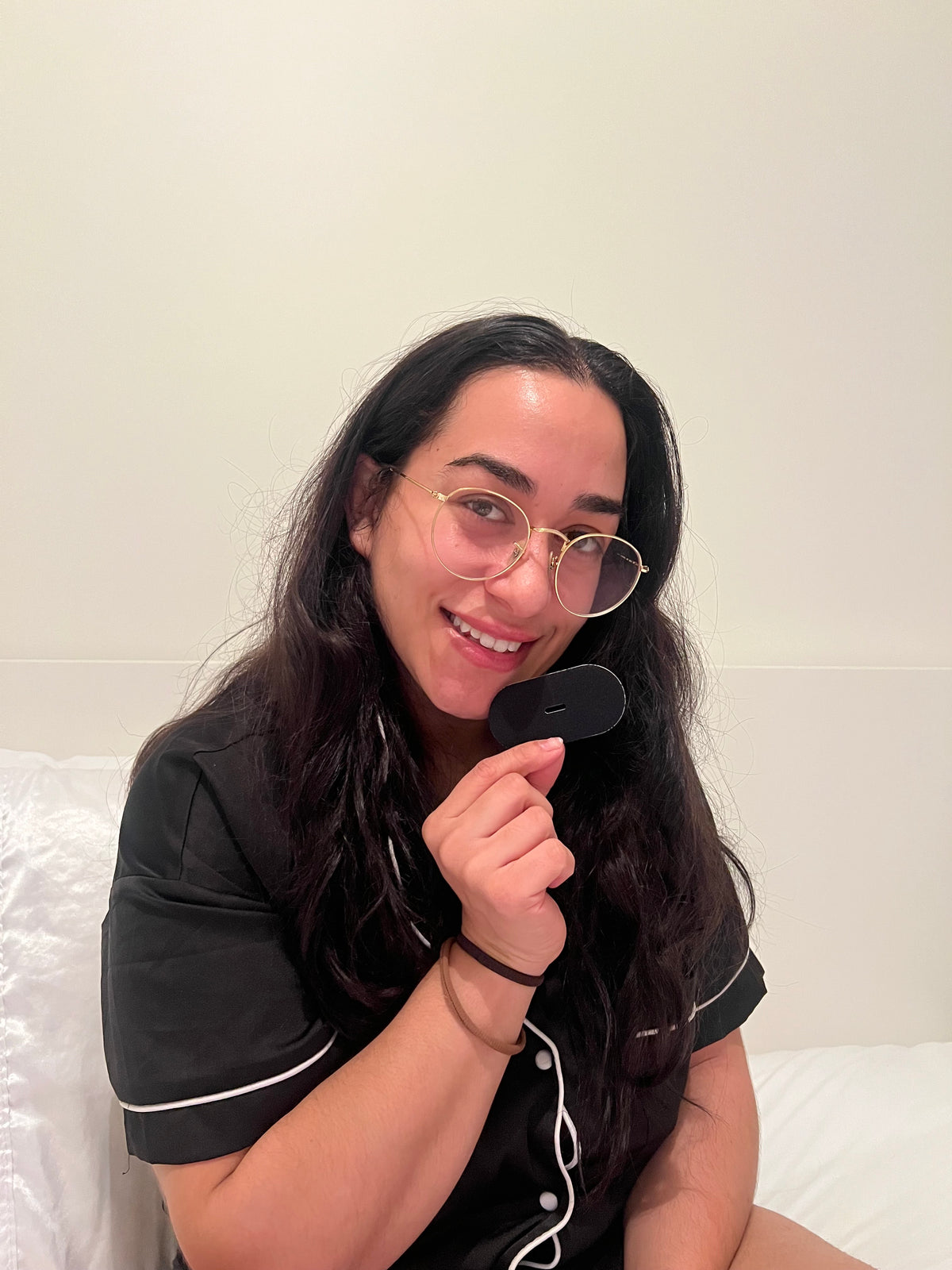Woman Holding a Schleepi Mouth Tape