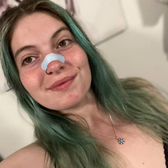 A Woman Using a Nose Strip