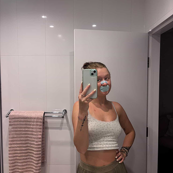 Woman Using Breathe Bundle & Taking Mirror Selfie