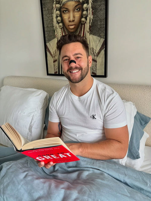 Man Using Best Nasal Strips for Nighttime Breathing